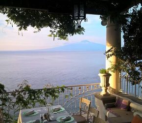 Terrace view from the dining table of the gulf/bay of Naples with mount Vesuvius in the background.